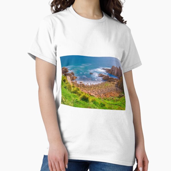 Item preview, Slow moving waves crashing on a beach with mysterious rock formations designed and sold by DesignBoard Photography.