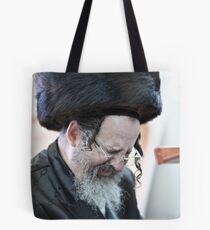 Praying in the Ohel of Rabbi Elimelech. Harcikn Dank ! A dank ojch zejer! Featured in Hat Heads. Tote Bag