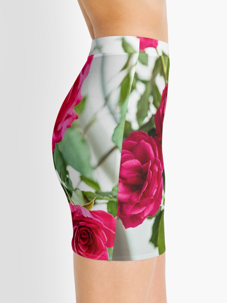 Pink mini skirt with red outlet flowers