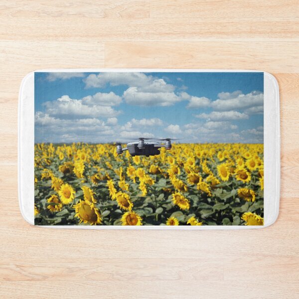 Item preview, The drone is flying over the sunflower field in summer designed and sold by goceris.