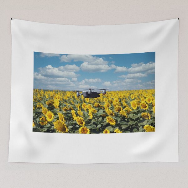 Item preview, The drone is flying over the sunflower field in summer designed and sold by goceris.