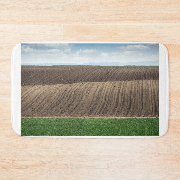 Item preview, Plowed and green wheat fields in spring landscape agriculture designed and sold by goceris.