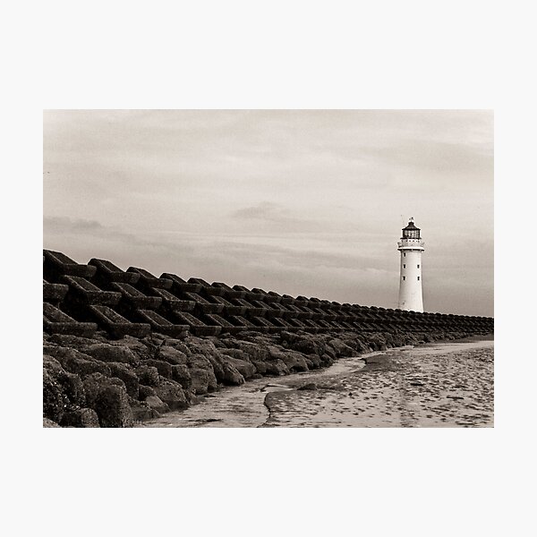Lighthouse and seawall Photographic Print