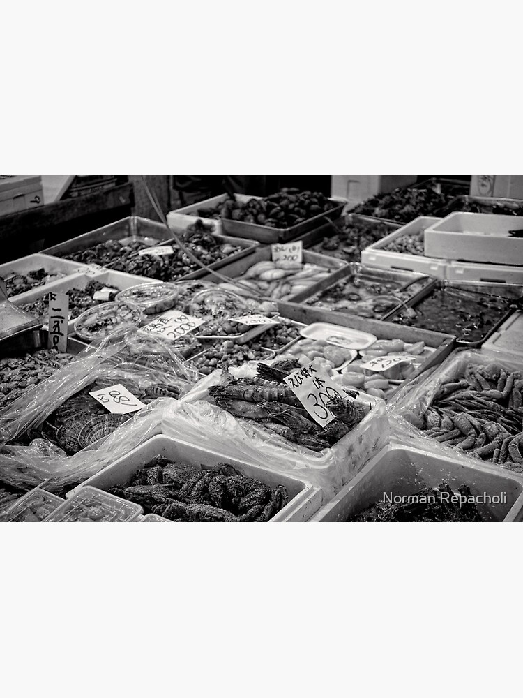 She sells sea food in the Tsukiji market stall - Japan by keystone