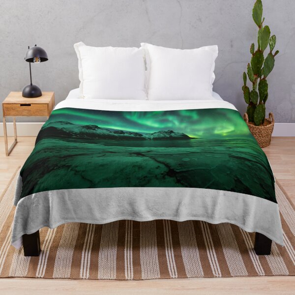 Item preview, Northern lights Iceland above Vestrahorn mountain in Stokksnes with ice in the foreground designed and sold by michieldros.