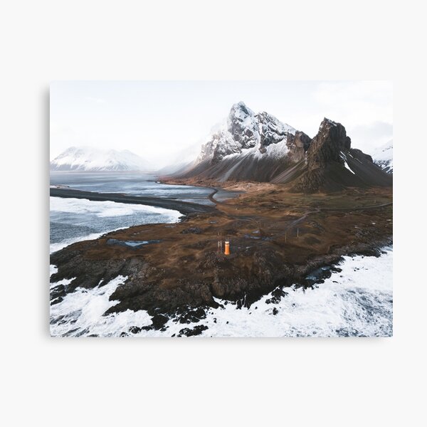 Orange lighthouse and black sand beach at Eystrahorn, Iceland Canvas Print