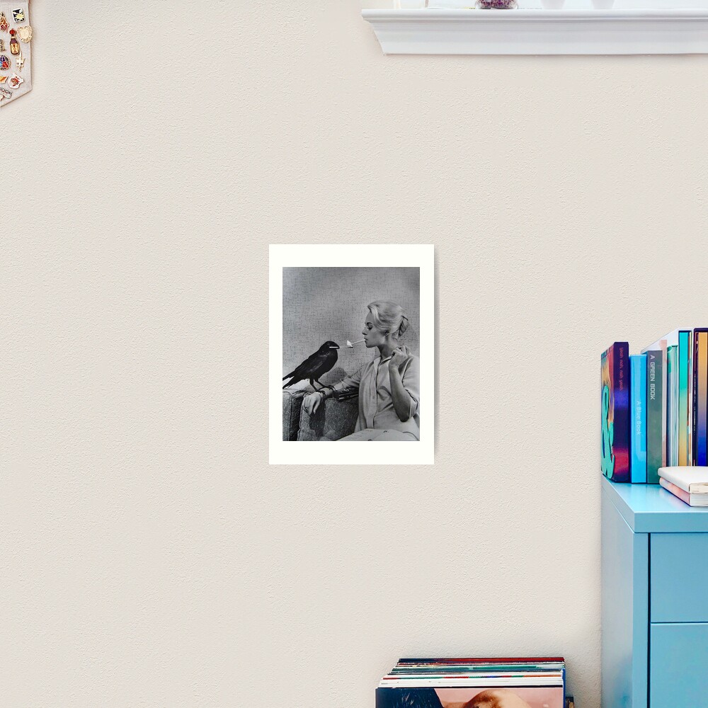 Tippi Hedren having her cigarette lit by a crow on the set of The Birds Art Print