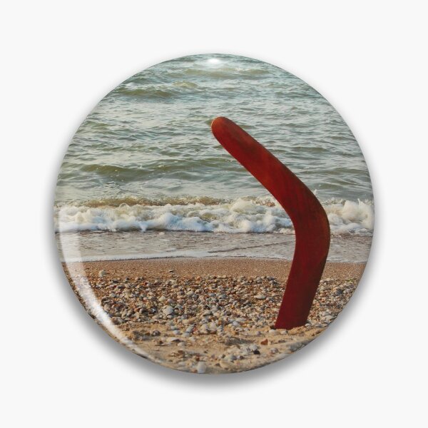 Item preview, Australian Boomerang on sandy beach against of sea surf and sky. designed and sold by IaroslavB.