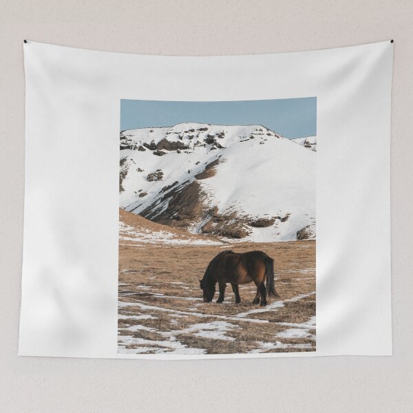 Item preview, Brown Icelandic horse in snowy green valley in Iceland designed and sold by michieldros.