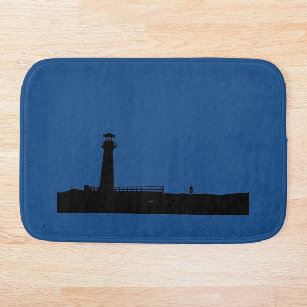 A person on a bicycle contemplates a magnificent sunset - modified photograph Bath Mat