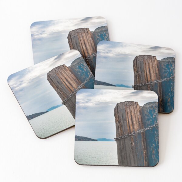 Item preview, Wood pillars wrapped in a chain on a lake in Italy. Island in the background dramatic blue skies great gift ideas for your traveling bestie  designed and sold by g2rdsmith.