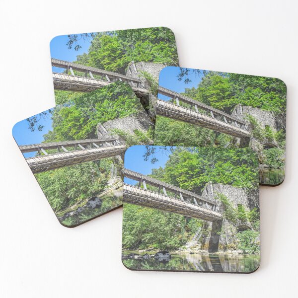 Item preview, Pedestrian bridge crossing wild river with old mill building designed and sold by Grégory DUBUS.