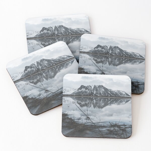 Item preview, Mountain covered in snow reflecting in a lake in Iceland designed and sold by michieldros.
