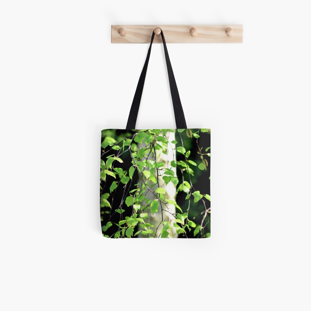 Birch tree leaves against the bark in the sunshine Tote Bag