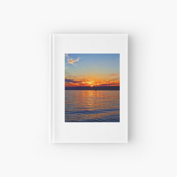 Sunset over the water Hardcover Journal