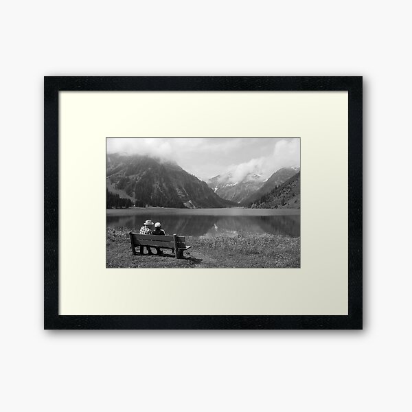Conversation on a bench Framed Art Print
