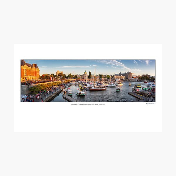 Canada Day in Victoria, Vancouver Island, Canada. Masses of people visiting the celebrations at inner harbour with the parliament building during sunset. Photographic Print