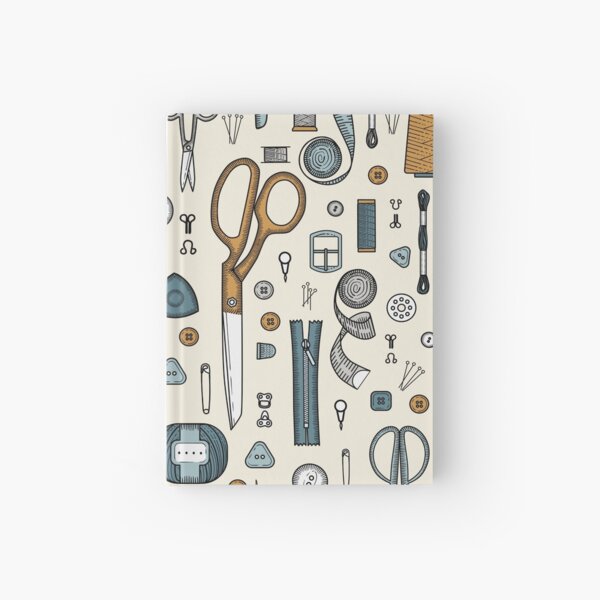 Handmade, sewing, embroidery, needlework items on a green background. Hardcover Journal