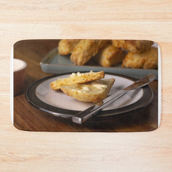 Item preview, Cheese scones with butter close up designed and sold by Karrakunga.