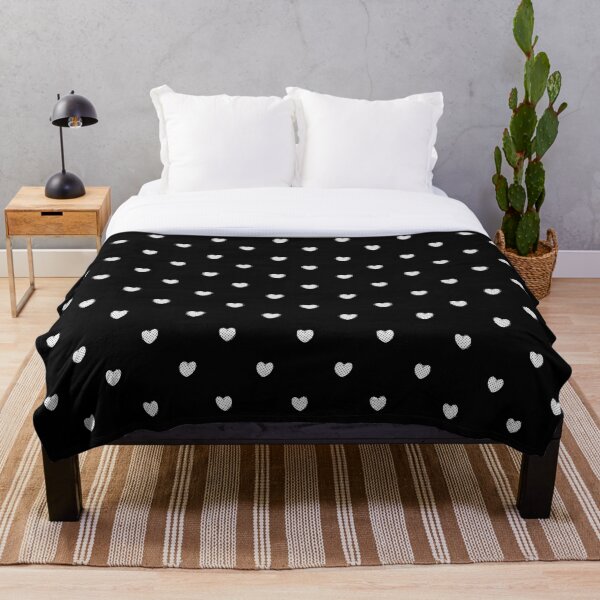 Aperçu de l'œuvre Petits coeurs à pois blancs sur fond noir créée et vendue par RootSquare.