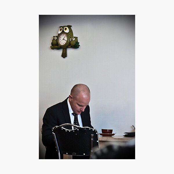 Man with owl clock Photographic Print