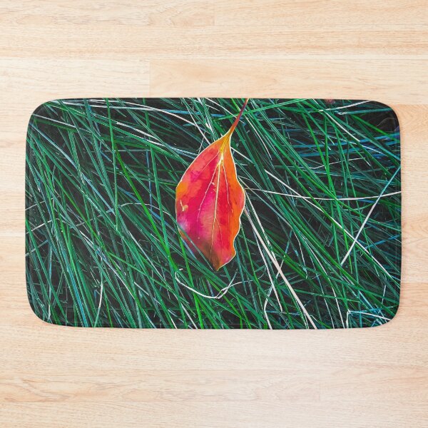Item preview, closeup orange leaves on the green grass field designed and sold by Mrvell.