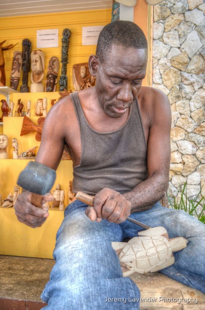 « Bahamian Sculptor carving the Wood at the Straw Market in Nassau