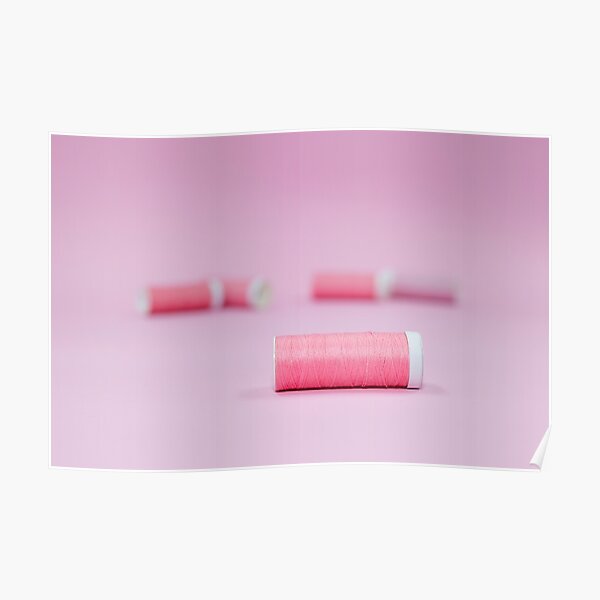 Pink sewing threads on a pink background Poster