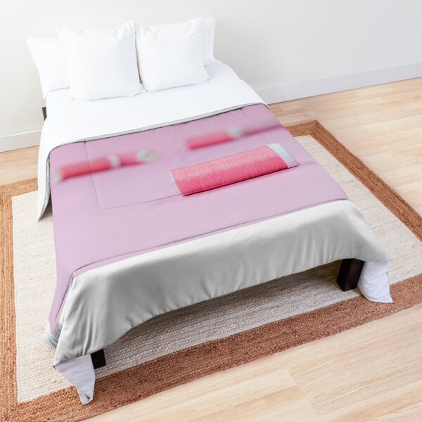Pink sewing threads on a pink background Comforter