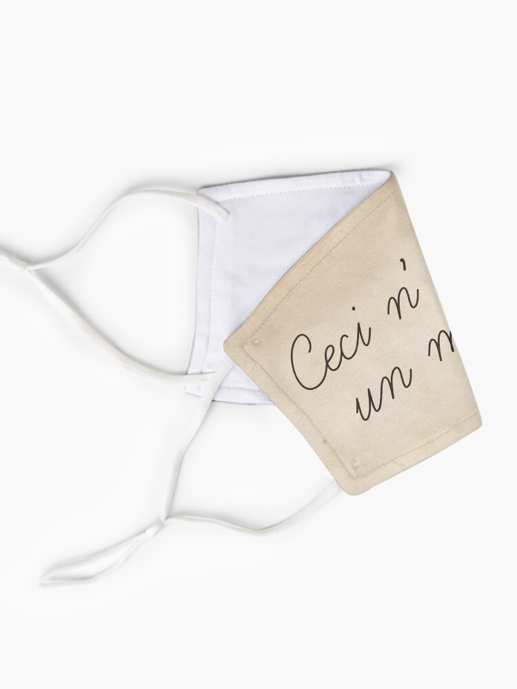 Alternate view of Magritte quote surrealist art style funny text. Ceci n'est pas un masque Mask