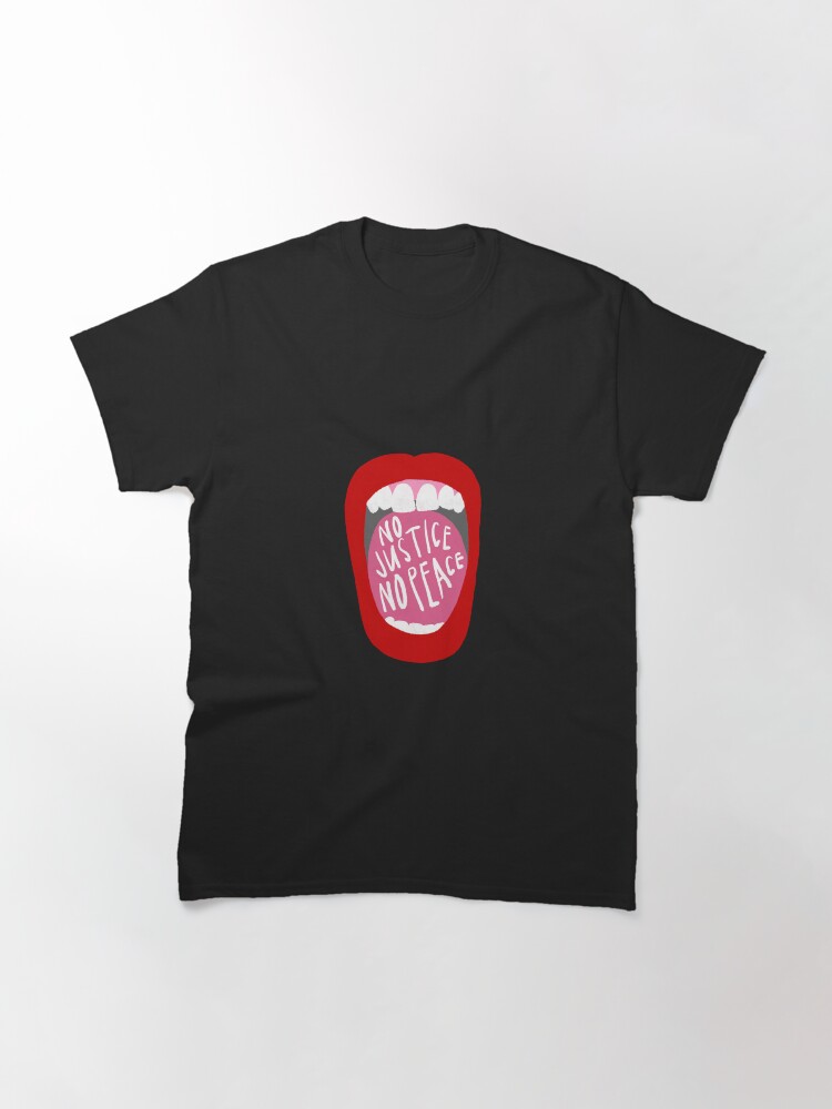 Imagen 3 de 7, Camiseta clásica con la obra Grita sin justicia no hay paz, diseñada y vendida por anna-ambrister.