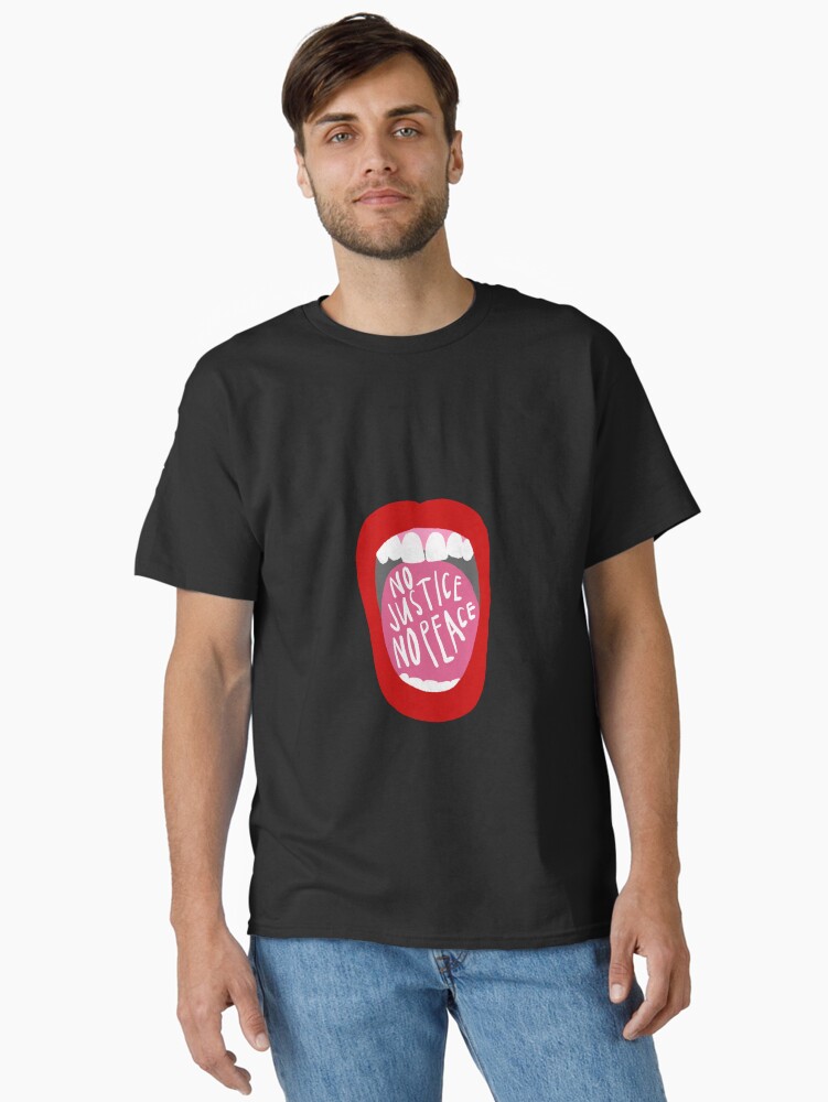 Imagen 1 de 7, Camiseta clásica con la obra Grita sin justicia no hay paz, diseñada y vendida por anna-ambrister.