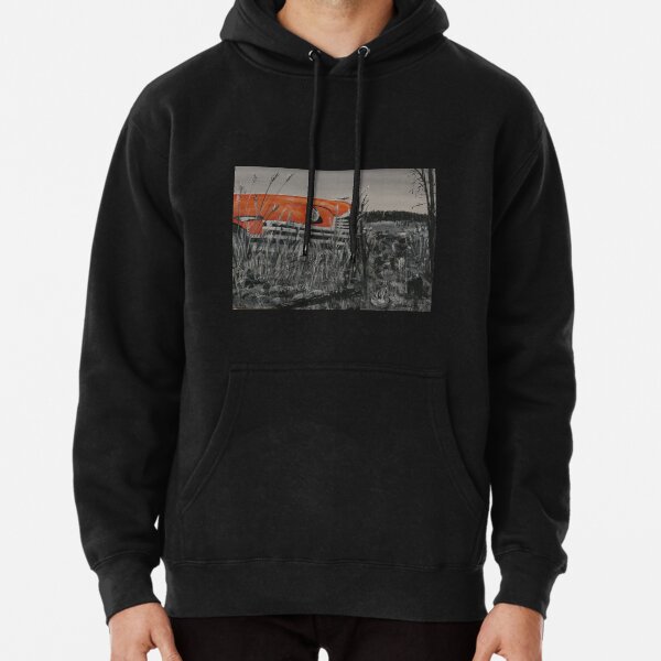 Antique orange car sitting in a field Pullover Hoodie