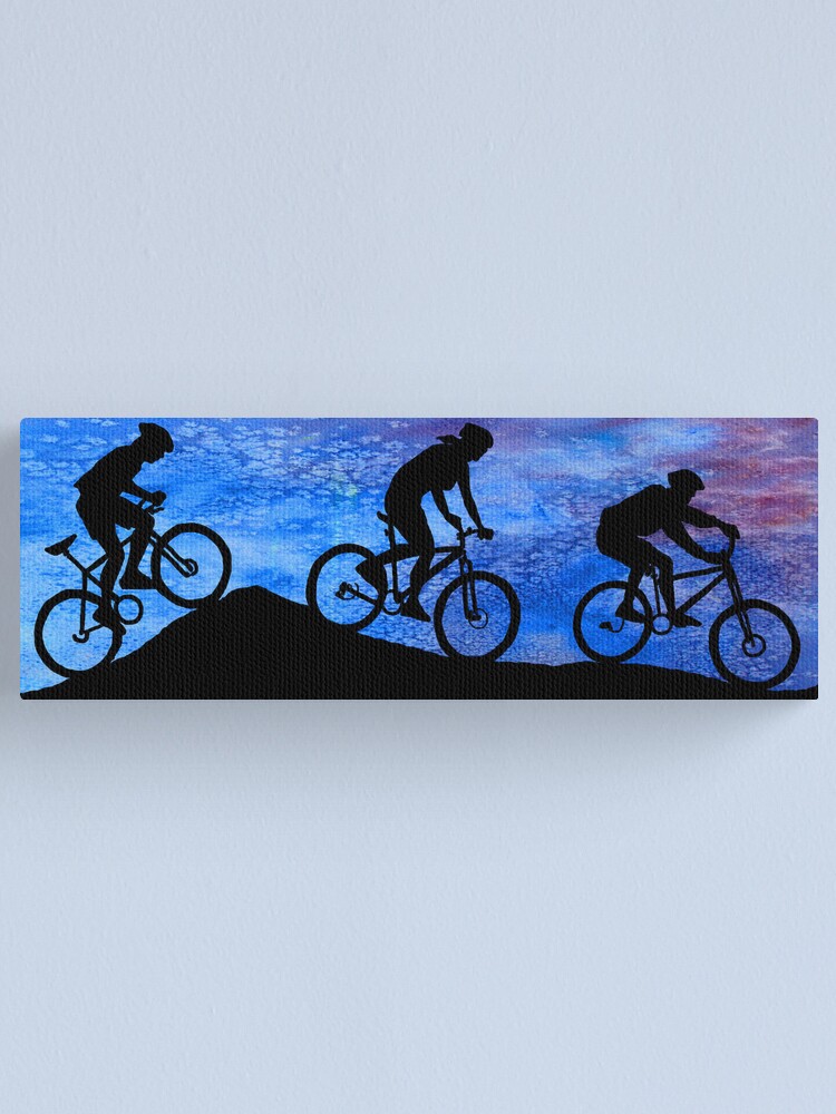 Three Mountain Bikers at Dusk