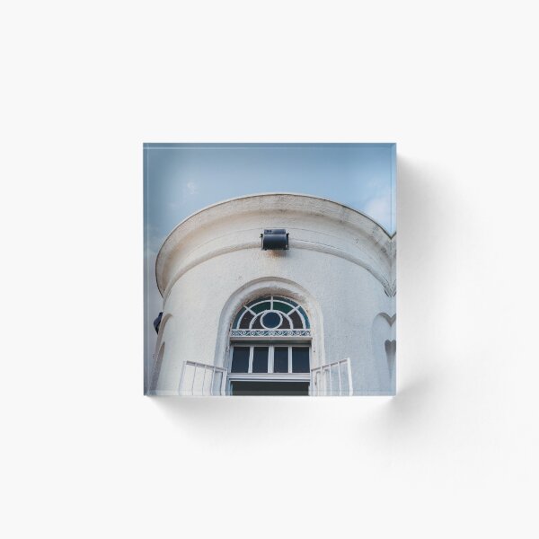 Item preview, A white tower with colorful windows and a cloudy sky designed and sold by Carmen Jost.