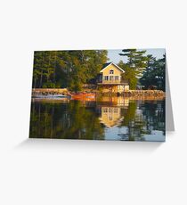 wooden boat with reflection near cottage St. Lawrence River Greeting Card