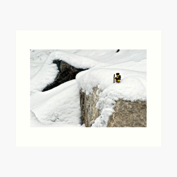 Hiker on snowy cliff Art Print