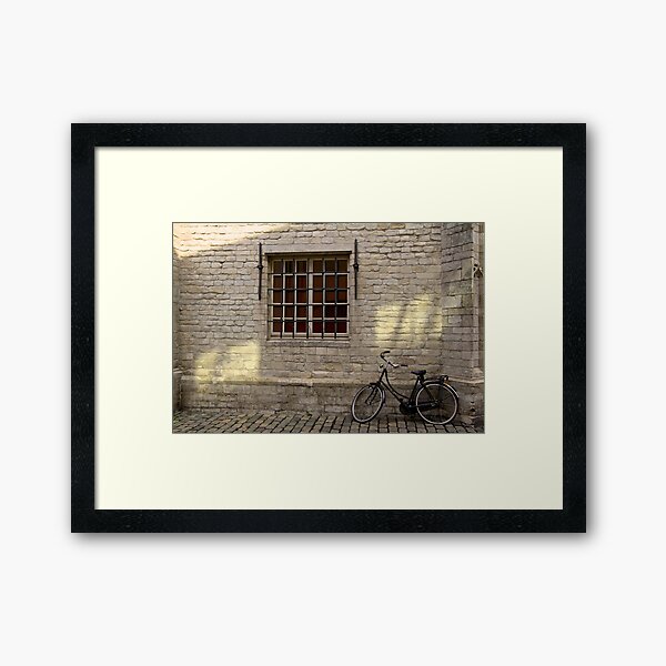 Bike leaning against Wall Framed Art Print