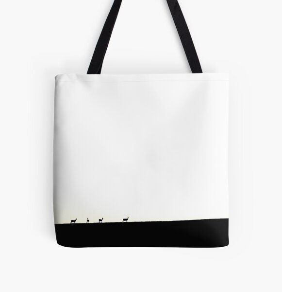 Deer figures, pixilated, silhouette, seen and photographed on a hill, at sunset, in the distance, games of shadows, lights and colors All Over Print Tote Bag