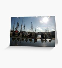 People relaxing on the harbourside with tall ships masts behind, Brest 2008 maritime festival, France Greeting Card