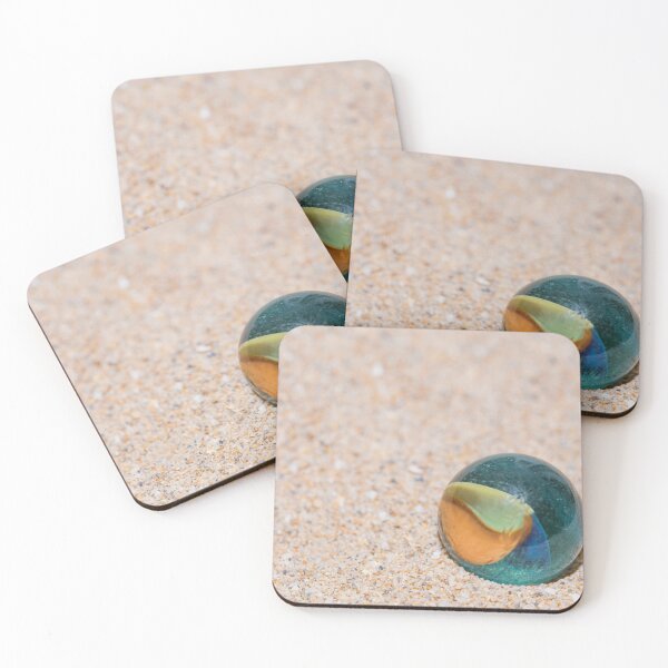 Item preview, Glass marble with colored interior resting on the sand designed and sold by brambillasimone.
