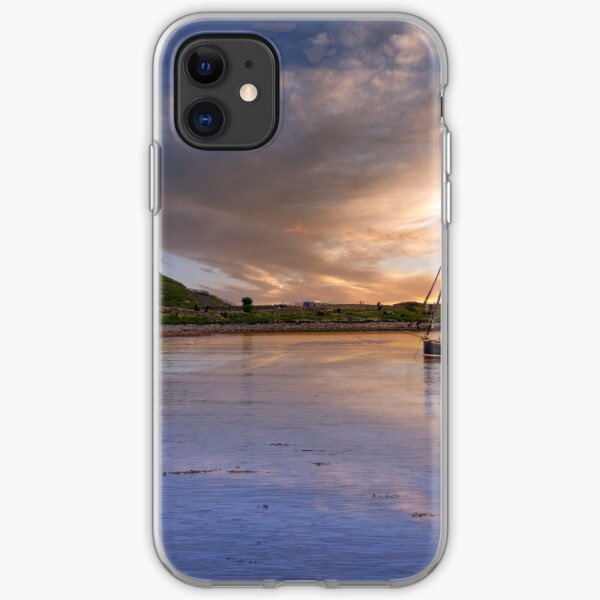 fishing boat in holy island harbour with lindisfarne castle iPhone Soft Case