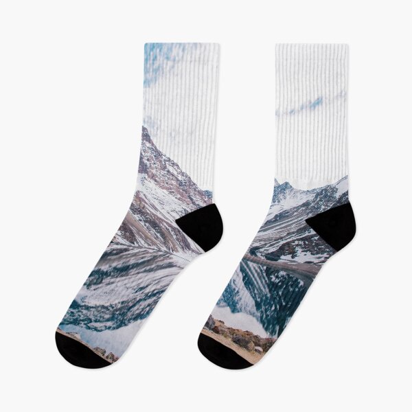 Item preview, A woman in blue in a landscape of snowy mountains reflecting in the water designed and sold by Carmen Jost.