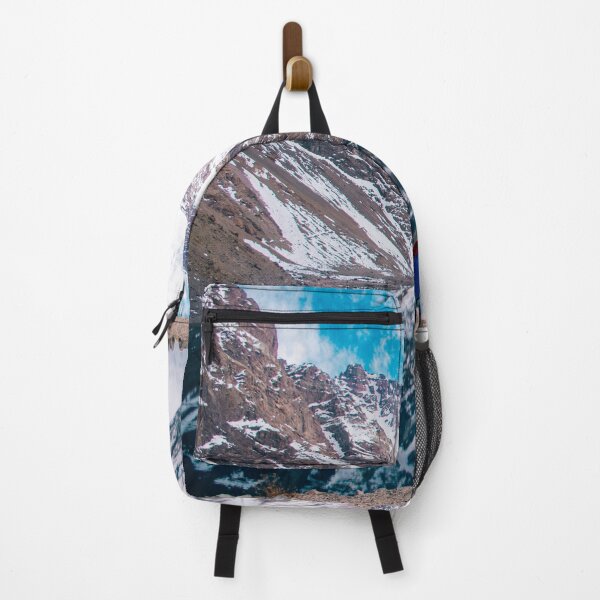 Item preview, A woman in blue in a landscape of snowy mountains reflecting in the water designed and sold by Carmen Jost.