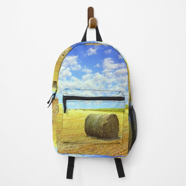 Item preview, Golden stubble field and hay bales against blue cloudy sky. designed and sold by IaroslavB.