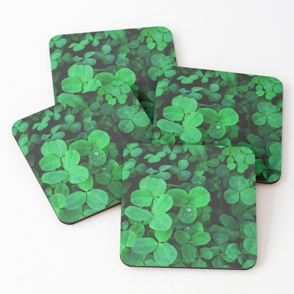 Item preview, Clover leaves with water drops in the sunlight. Clover leaves on a summer meadow.  designed and sold by Kizuneko.