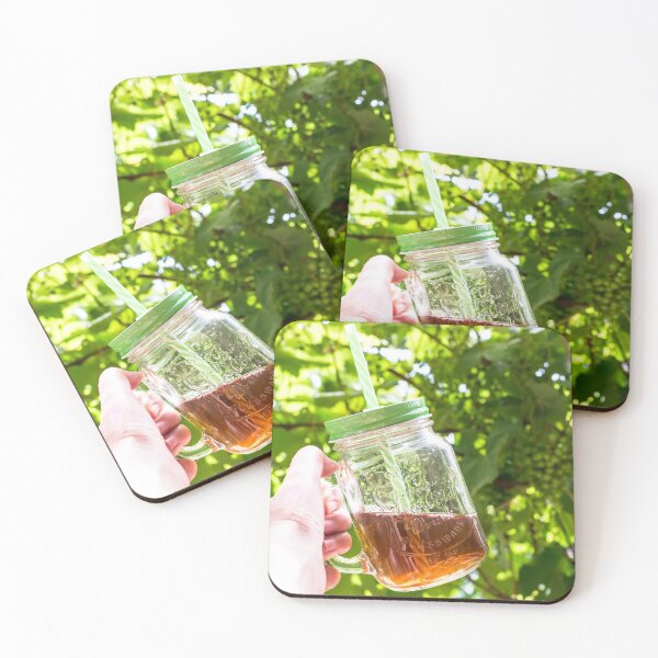 Item preview, Hand holding a glass mug of cold tea designed and sold by lena-maximova.
