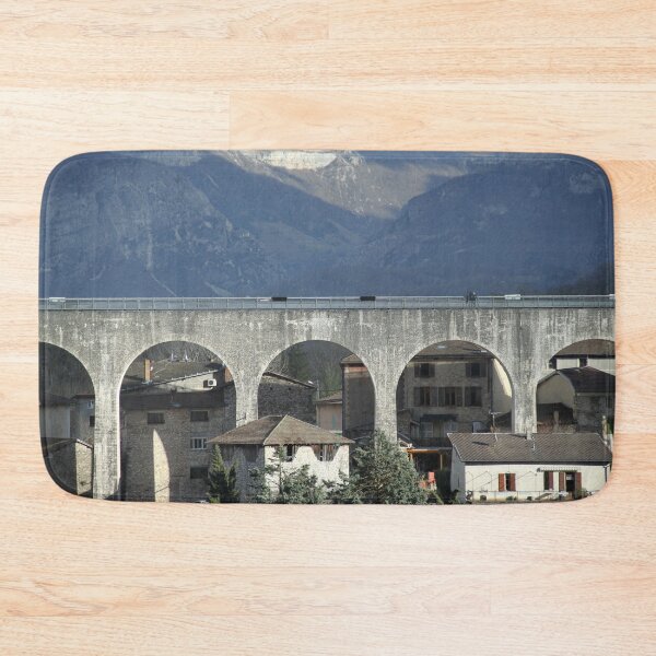Item preview, Concrete bridge in front of cliffs and mountains designed and sold by EstelleRossetti.