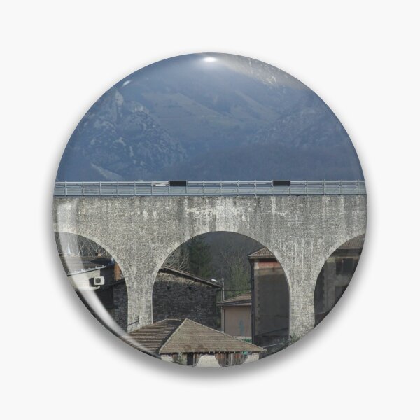 Item preview, Concrete bridge in front of cliffs and mountains designed and sold by EstelleRossetti.