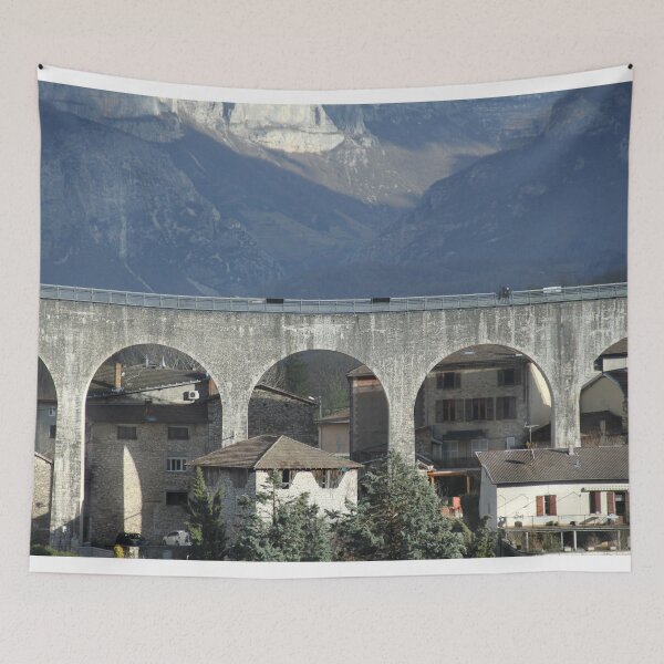 Item preview, Concrete bridge in front of cliffs and mountains designed and sold by EstelleRossetti.